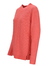 Korallenfarbener Pullover mit Zickzackmuster und gerippten Manschetten.