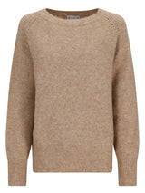 Beige gestrickter Pullover mit gerippten Bündchen und Saum, wahrscheinlich aus Wolle- oder Baumwollmischung.