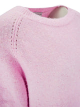 Rosa Pullover mit Spitzenbesatz und geripptem Ausschnitt.
