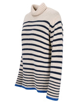 Gestreifter Rollkragenpullover mit Marine- und Cremefarbenen Streifen, aus weicher Wolle gefertigt.