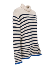 Gestreifter Rollkragenpullover mit blauen und schwarzen Streifen auf cremefarbenem Hintergrund, aus weicher Wolle gefertigt.