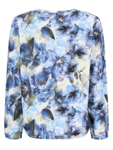 Blause mit blauem Blumenmuster, langen Ärmeln und rundem Ausschnitt.