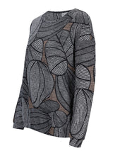 Schwarzer und weißer Blattmuster-Pulli mit langen Ärmeln.