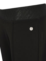 Schwarze maßgeschneiderte Anzughosen mit silberner Knopf- und Reißverschlussdetails.