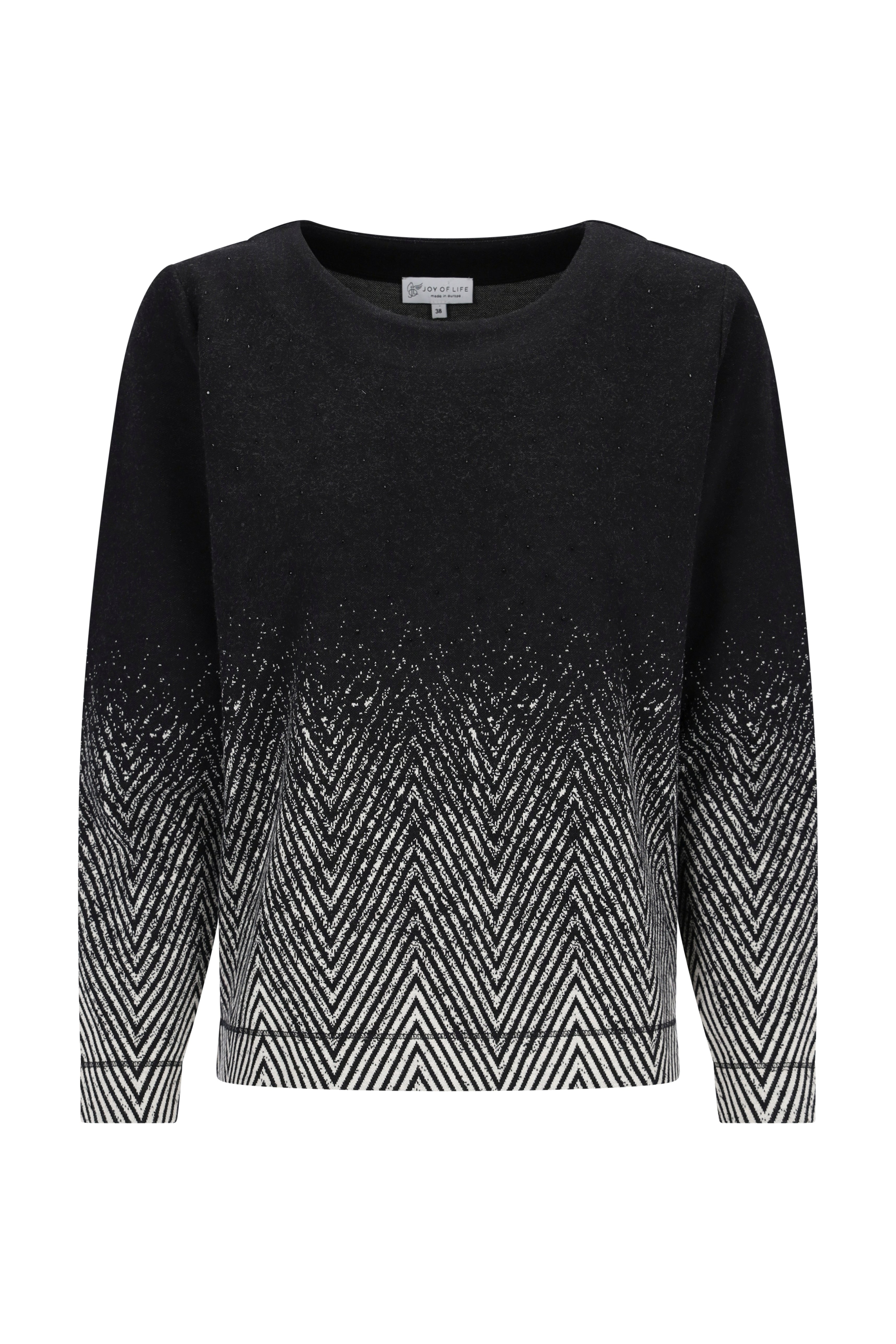 Schwarzer und weißer strickshirt soft touch mit zigzag-muster und funkelnden silbernen chevron-verzierungen