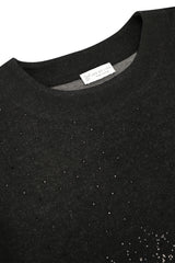 Schwarzes strickshirt soft touch mit strukturierter oberfläche und dezent schimmernden punkten sowie joy of life etikett