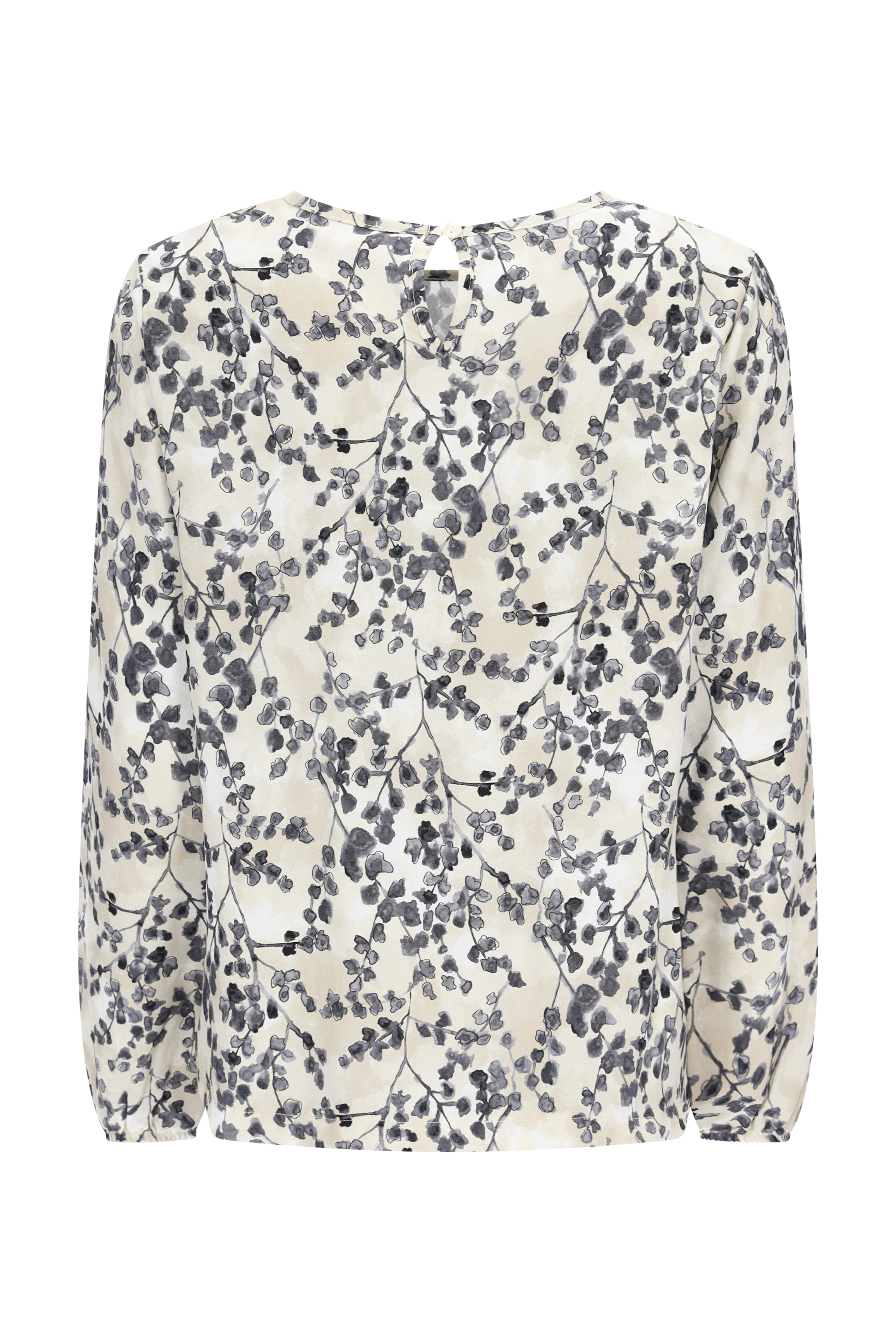 Eine zarte ivory bluse bedruckt mit langärmeligem fließendem design und elegantem schwarz-grauem botanischem muster