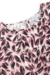 Bluse blütenprint mit lebhaftem pink-schwarzem blättermuster auf cremefarbener baumwolle mit rundhalsausschnitt joy of life label
