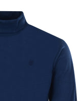 Marineblauer Rollkragenpullover.