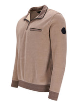 Beige Samtjacke mit Reißverschluss, Tasche und Aufnäher am Ärmel.