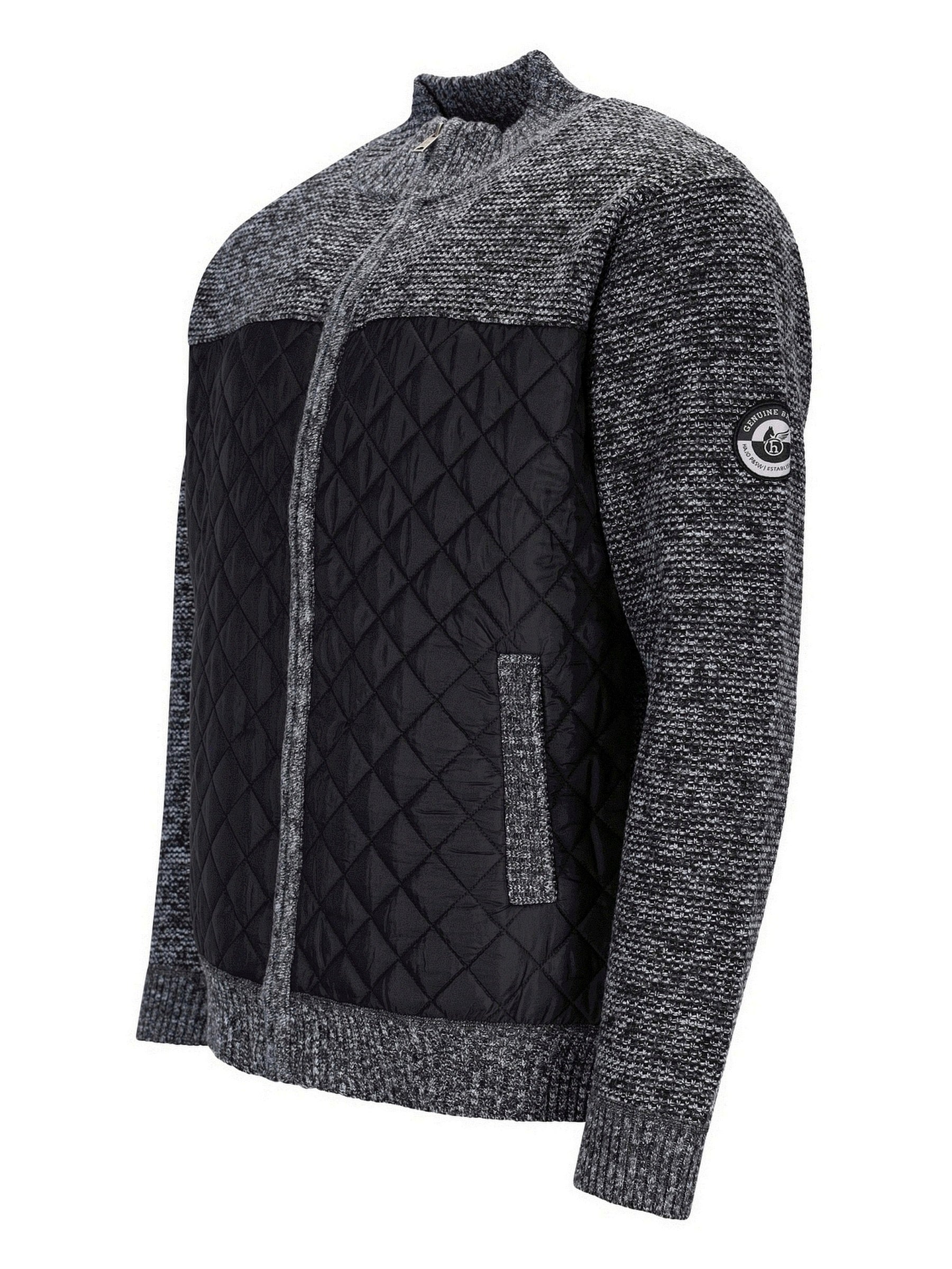 Kohle-graue und schwarze Steppjacke mit strukturiertem Strickmuster.