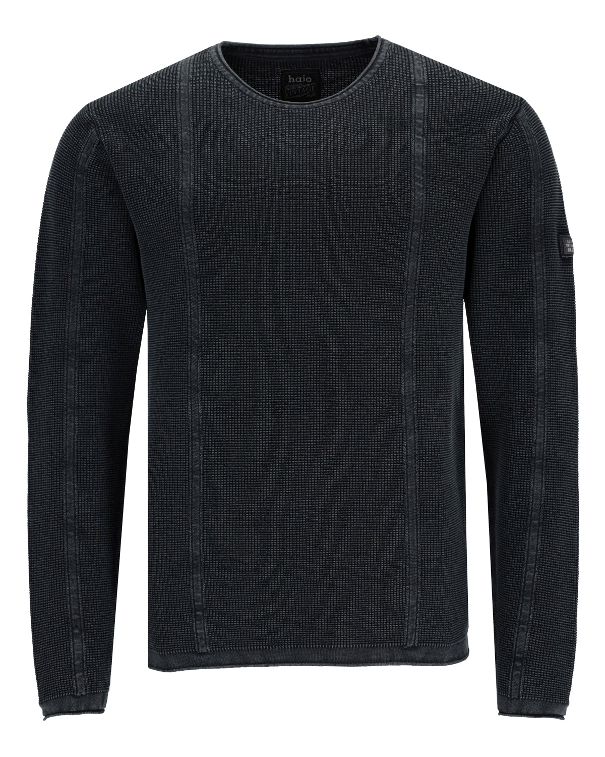 Schwarzes Langarmshirt mit Rundhalsausschnitt aus Waffelstrick mit vertikalen Nähten.