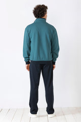 Blaugrüne Bomberjacke für Herren mit schwarzen Bündchen und Saum.