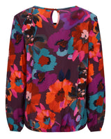 Geblümte Bluse mit langen Ärmeln und Schlüssellochausschnitt in leuchtenden Farben wie Lila, Orange, Blau, Rosa und Rot auf dunklem Grund.