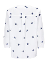 Rückseite der Bluse mit Stickerei: weiß mit marineblauem Distel-Stickerei