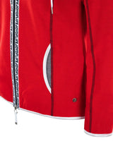 Rot-weiße Jacke mit Reißverschluss und Bandverzierung.