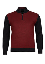 Pullover aus Merinowolle mit schwarzem und rotem Farbblockmuster, Reißverschluss am Kragen.