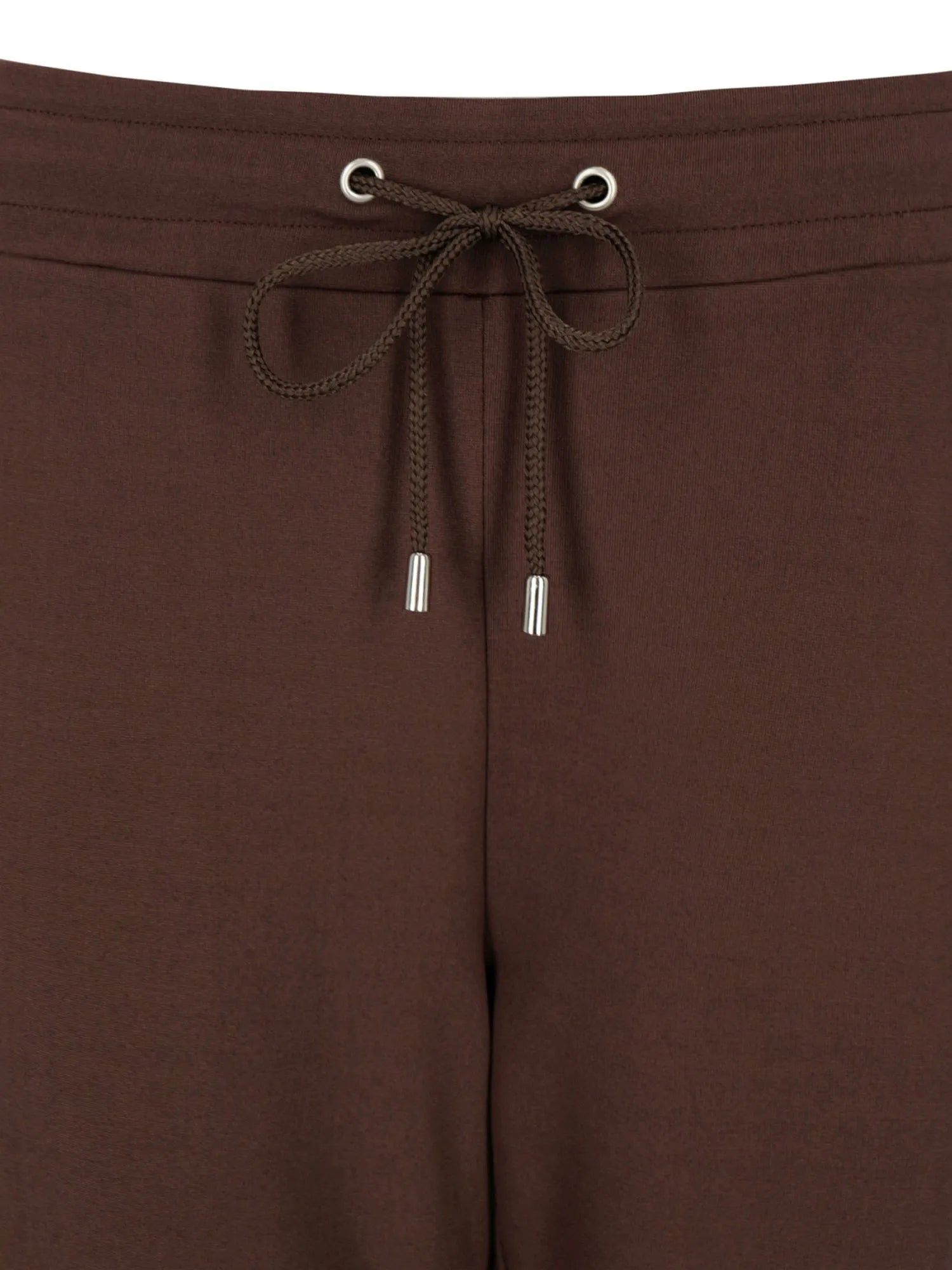 Braune Hosen mit Kordelzugbund, silbernen Ösen und Kordel.