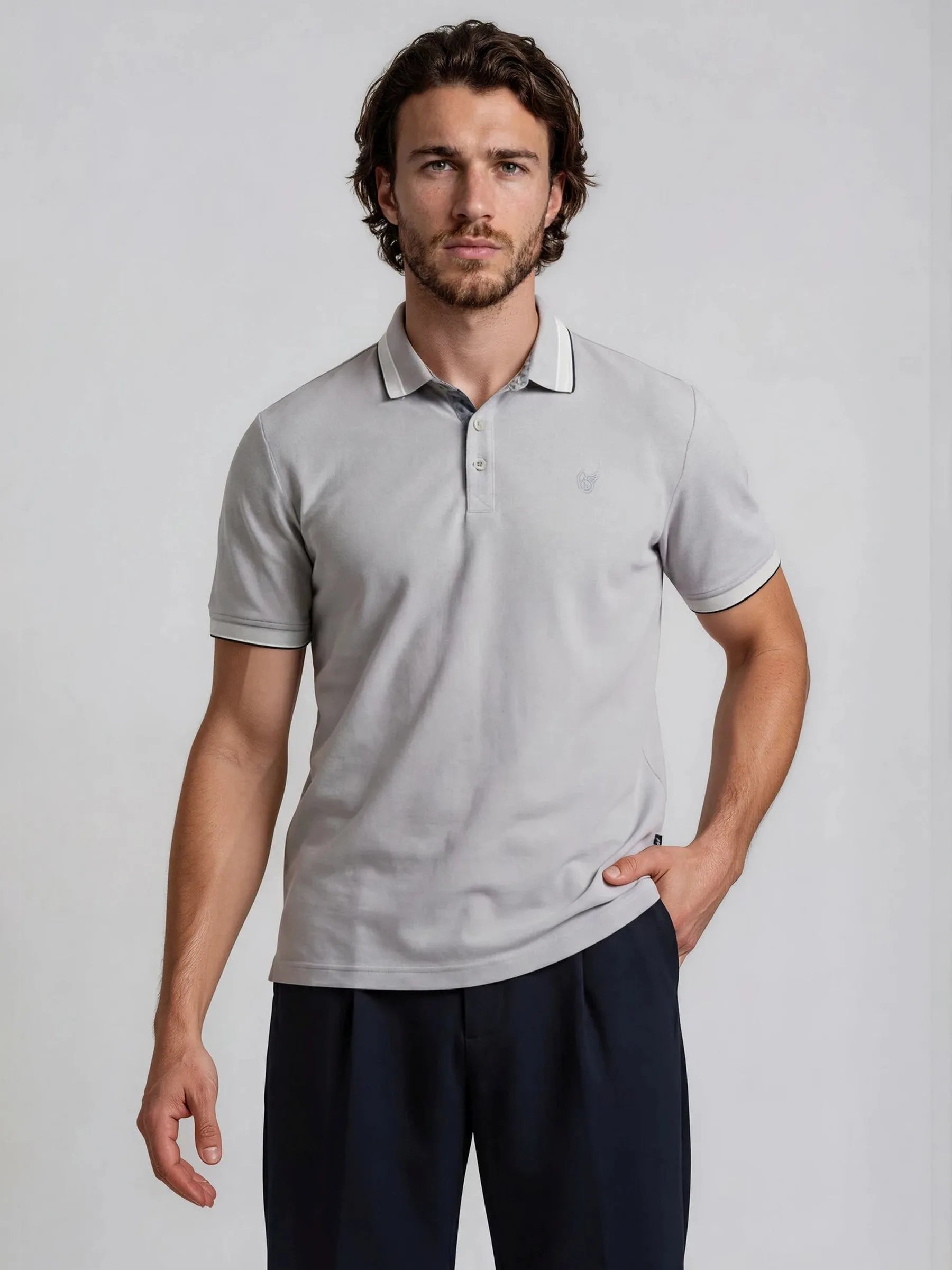 Light gray poloshirt capacity pique with subtle textured fabric and contrasting white collar and sleeve trim