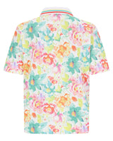 Poloshirt mit Blumendruck, leuchtenden Farben und gestreiftem Kragen.