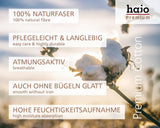 Weiße Baumwollkapsel an einem Stängel, die natürliche Faser mit weicher, flauschiger Textur zeigt.