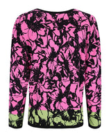 Neonrosa und grüner Pullover mit Blumendruck und schwarzer Spitze.