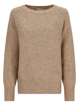 Beige gestrickter Pullover mit gerippten Bündchen und Saum, wahrscheinlich aus Wolle- oder Baumwollmischung.