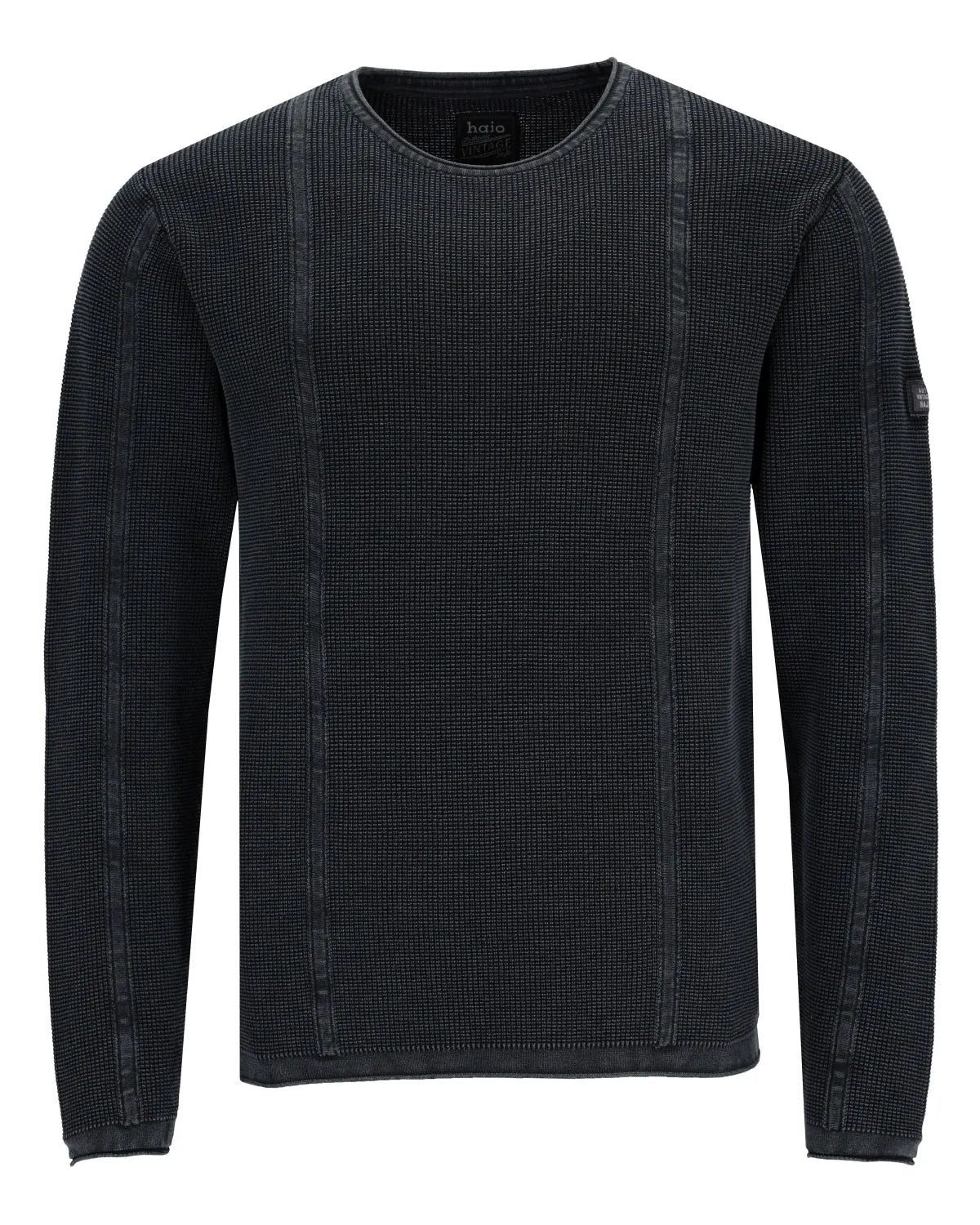 Schwarzes Langarmshirt mit Rundhalsausschnitt aus Waffelstrick mit vertikalen Nähten.