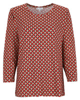 Rote und beigefarbene Bluse mit geometrischem Muster und langen Ärmeln.