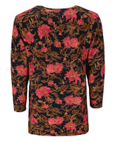 Langärmeliges Top mit Blumendruck und rosa und braunen Blumen auf schwarzem Hintergrund.