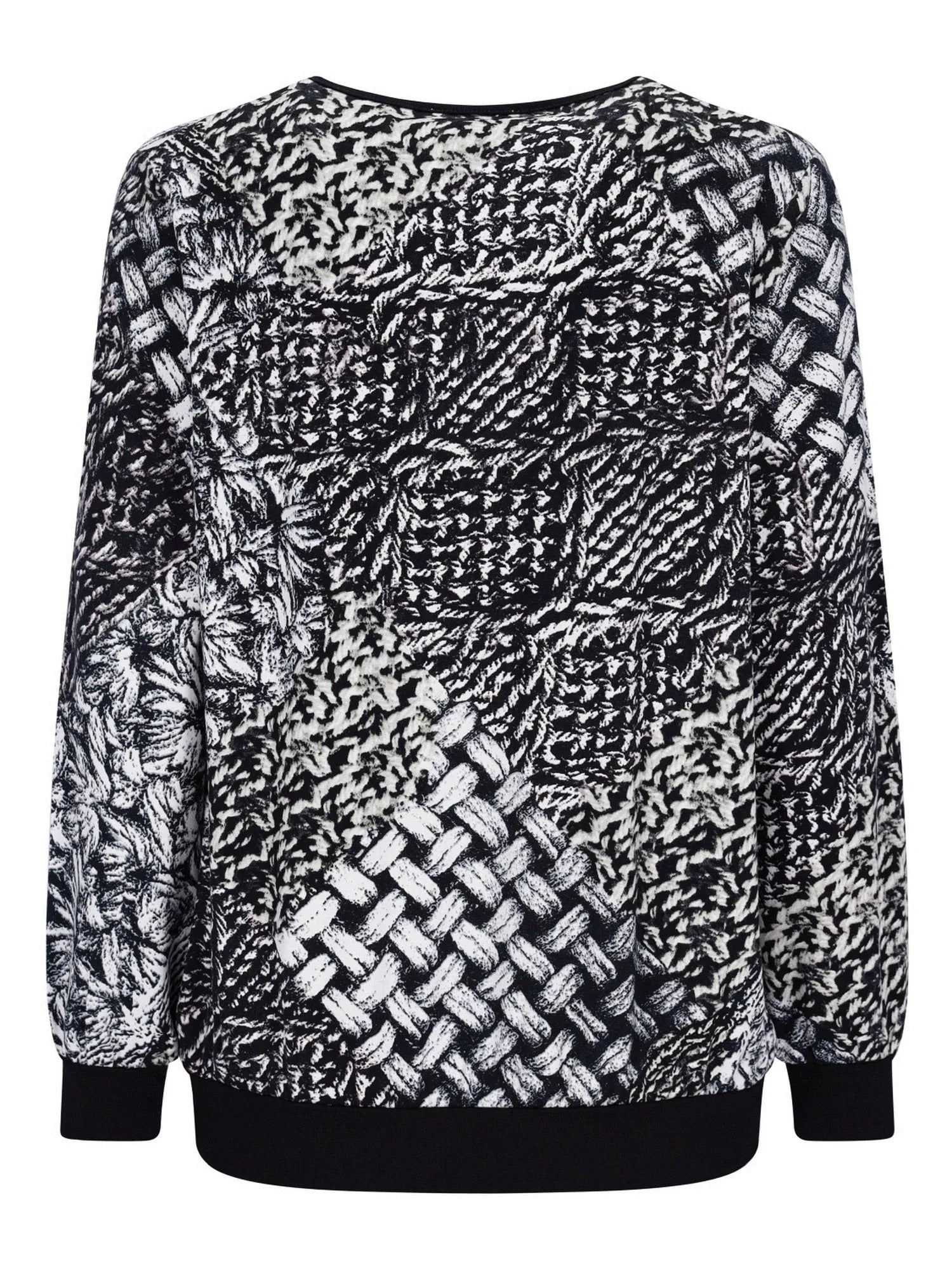 Schwarz-weiß gemusterter Pullover mit gewebtem Design, wahrscheinlich aus Baumwolle oder Polyester.
