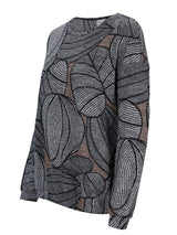 Schwarzer und weißer Blattmuster-Pulli mit langen Ärmeln.