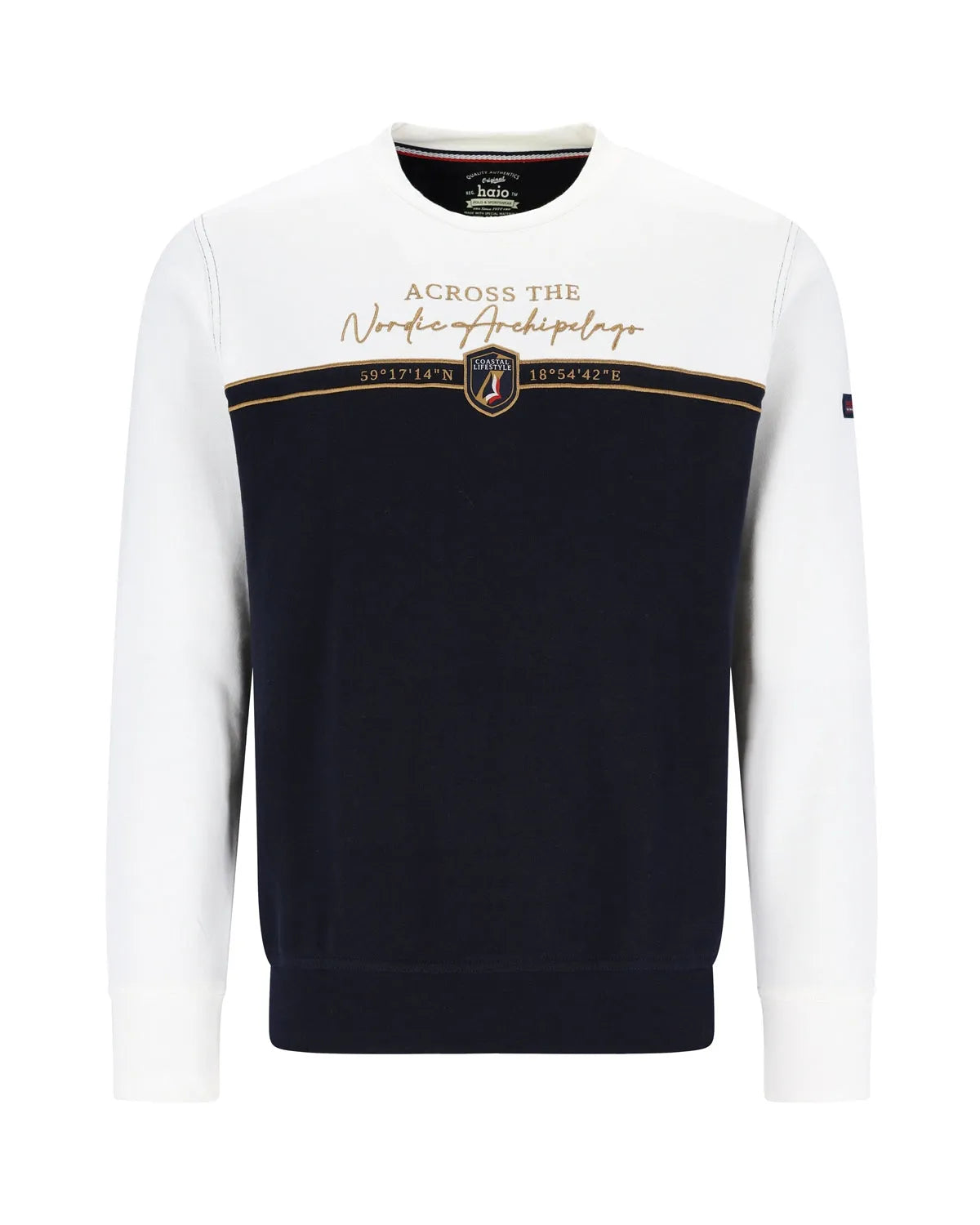 Marineblauer und weißer Pullover mit Rundhalsausschnitt und goldenem Emblem.